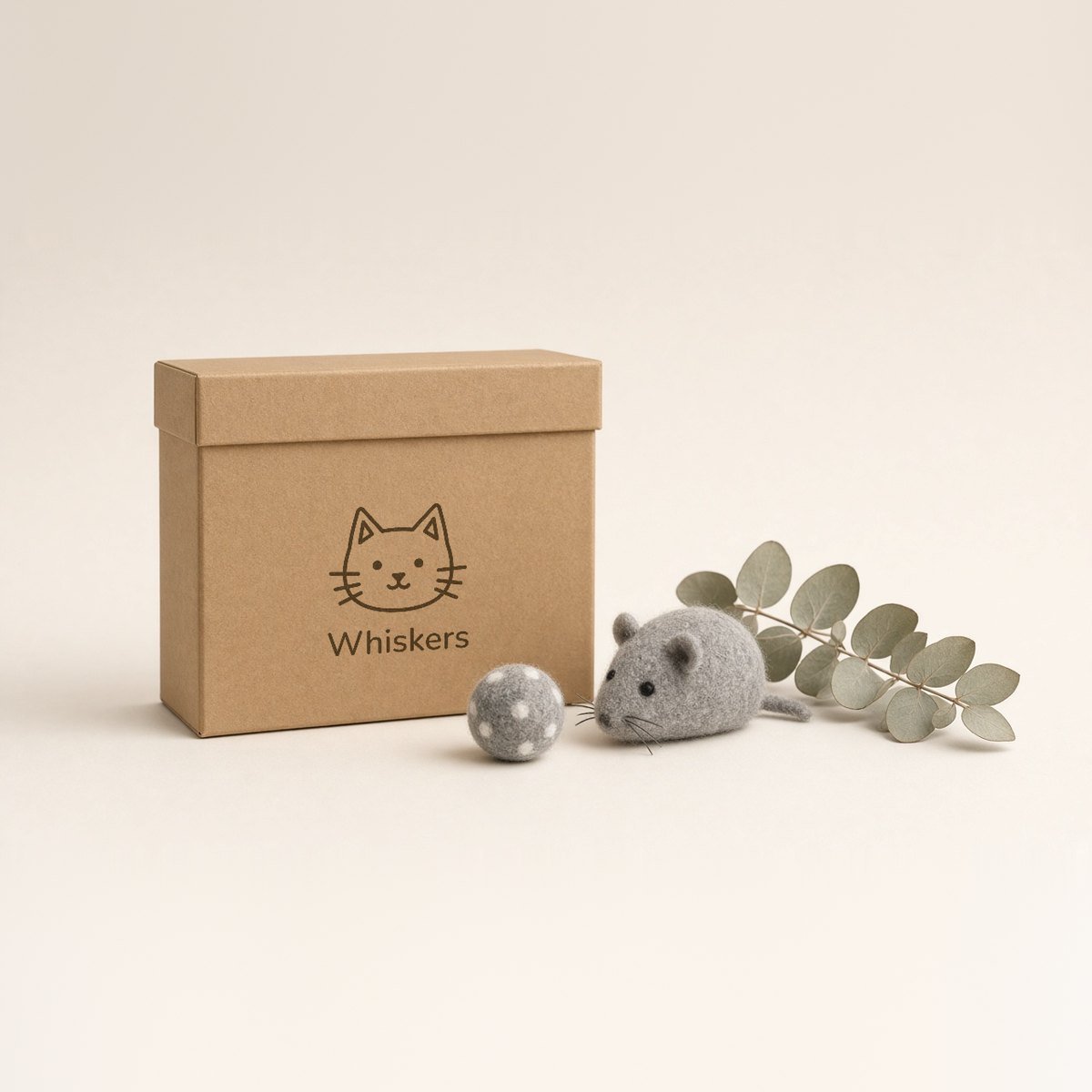 Kraft box printed with the Whiskers cat logo